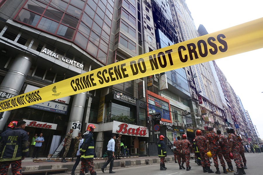 Crime scene tape is used to block an area in Banani surrounding the FR Tower, which was hit by a deadly blaze on Thursday noon — FE photo