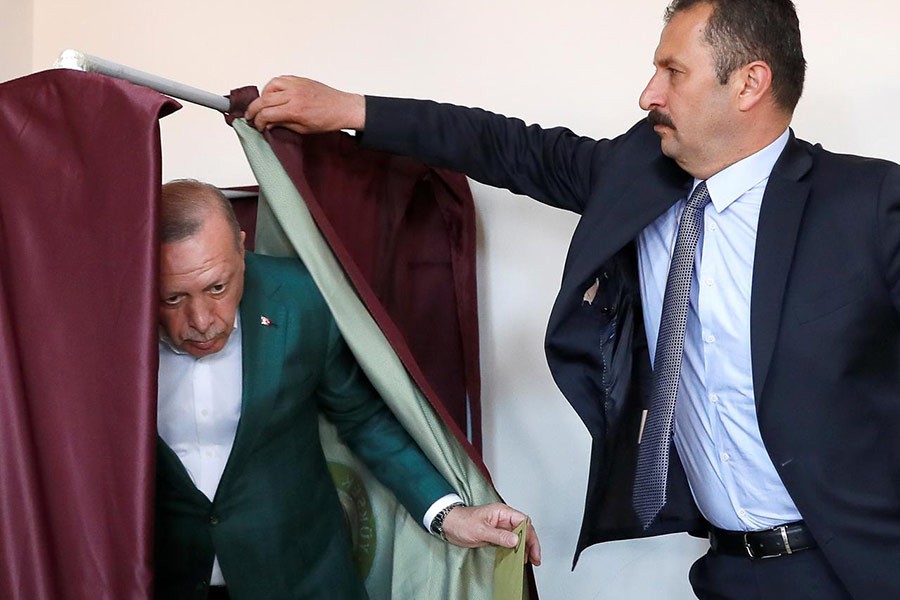 Turkish President Tayyip Erdogan attending a voting at a polling station during the municipal elections in Istanbul, Turkey on Sunday. -Reuters Photo