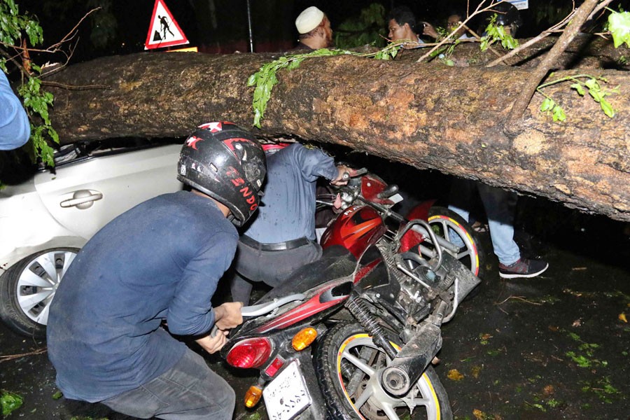 The storm blew away the signboard of Shahbagh Police Station, upended an electricity pole on Minto Road - Focus Bangla photo