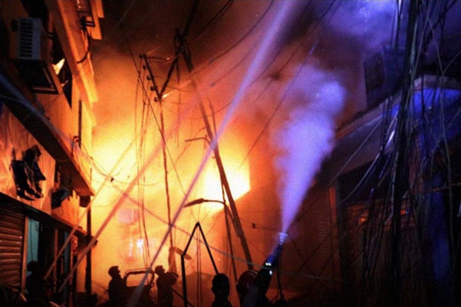 Fire-fighters work at the scene of a fire that broke out at a chemical warehouse in Old Dhaka, February 21, 2019 (Reuters)