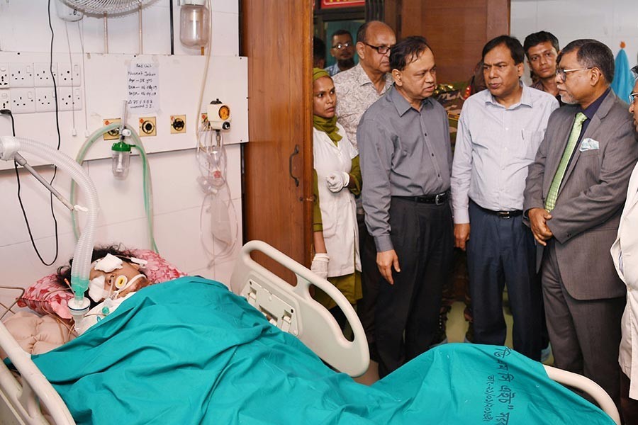 Health Minister Zahid Maleque visiting Feni madrasa student Nusrat Jahan Rafi, who is undergoing treatment at burn unit of Dhaka Medical College Hospital (DMCH) on Monday. -PID Photo