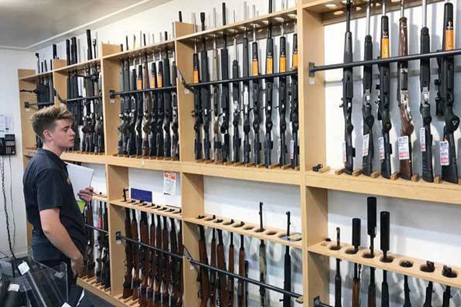 A man looks at firearms on display at Gun City gunshop in Christchurch, New Zealand on March 19, 2019 — Reuters/Files