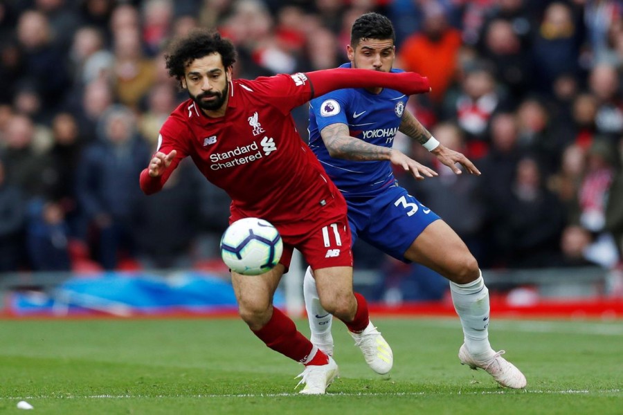 Premier League - Liverpool v Chelsea - Anfield, Liverpool, Britain - April 14, 2019 Liverpool's Mohamed Salah in action with Chelsea's Emerson Palmieri - Action Images via Reuters/Lee Smith