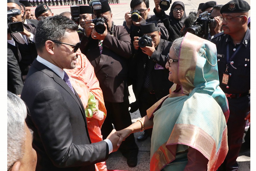 Crown Prince of Brunei Darussalam Haji Al-Muhtadee Billah welcomed the premier at the airport in Bandar Seri Begawan — Focus Bangla photo