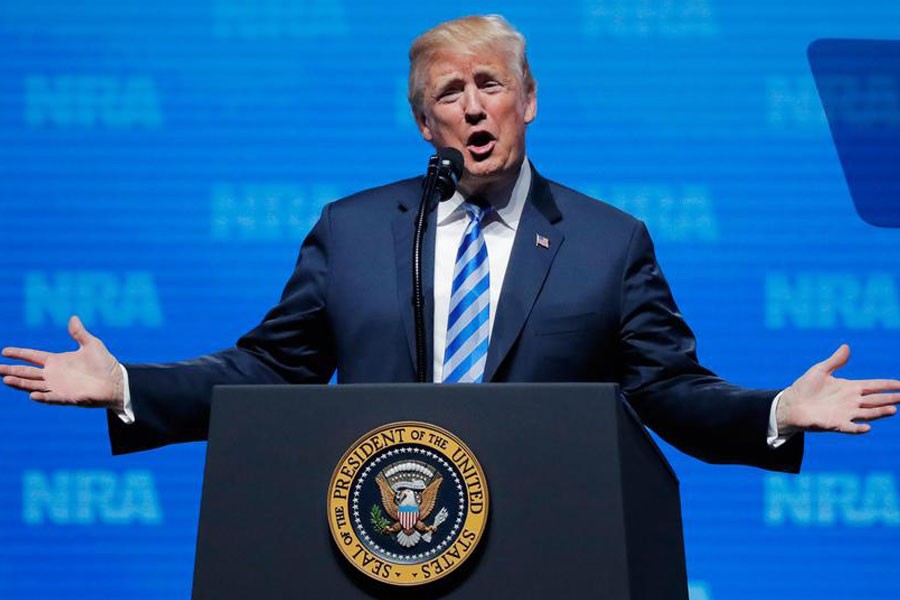 US President Donald Trump gestures before he speaks at a National Rifle Association (NRA) convention in Dallas, Texas, US May 4, 2018 - REUTERS/Lucas Jackson/ Files