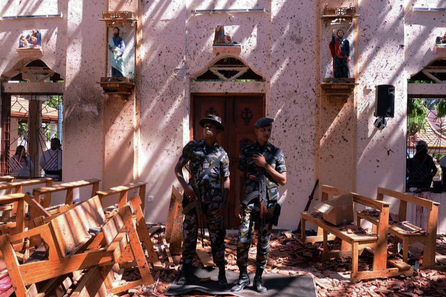 Sri Lankan military stand guard inside a church after an explosion in Negombo, Sri Lanka, April 21, 2019. Reuters/Files