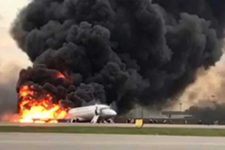 A passenger plane is seen on fire after an emergency landing at the Sheremetyevo Airport outside Moscow, Russia May 5, 2019. The Investigative Committee of Russia/Handout via Reuters