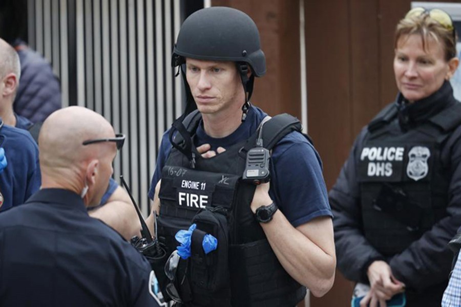 Policemen gather at the recreation centre where students were reunited with their parents after a shooting at a suburban Denver middle school Tuesday, May 7, 2019, in Highlands Ranch, Colorado — AP photo