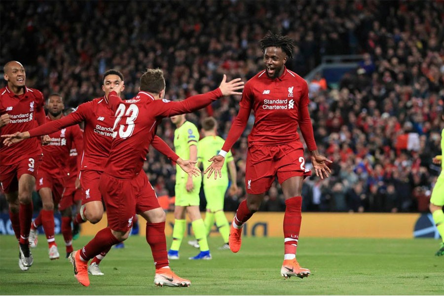 Liverpool’s Divock Origi, right, celebrates scoring his side’s fourth goal of the game during the Champions League Semi Final, second leg soccer match between Liverpool and Barcelona at Anfield, Liverpool, England, Tuesday, May 7, 2019 - Peter Byrne/PA via AP