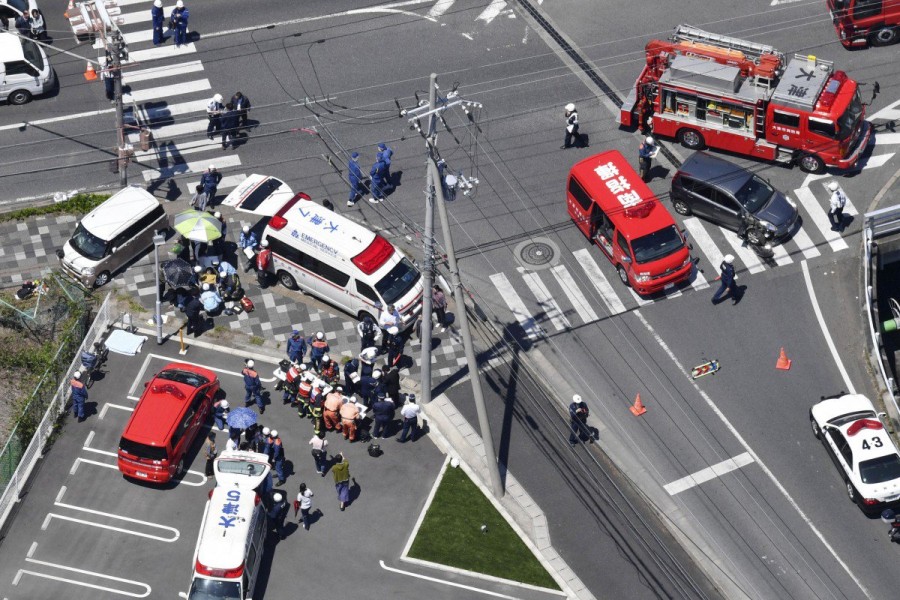 Police investigates the site where a car slammed into a group of 16 people, mostly kindergarten children. Photo: APPolice investigates the site where a car slammed into a group of 16 people, mostly kindergarten children. Photo: AP Police investigates the site where a car slammed into a group of 16 people, mostly kindergarten children - Photo: AP