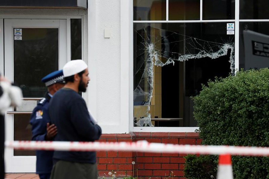 Members of Muslim religious groups offer prayers at the site of the shooting outside Linwood Mosque in Christchurch, New Zealand on March 18, 2019 — Reuters/Files