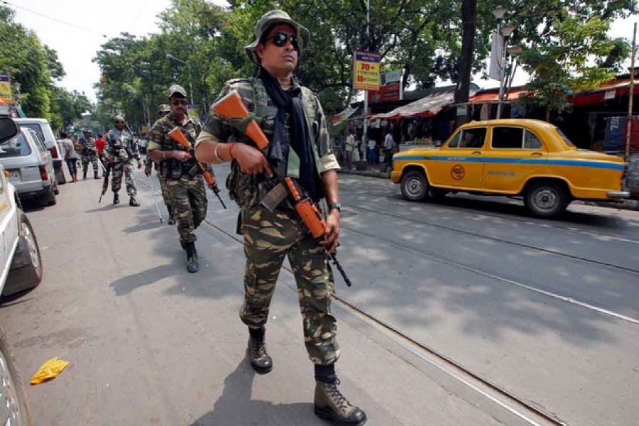 Central Reserve Police Force (CRPF) personnel conduct route march in a street ahead of the seventh and last phase of general election, in Kolkata, India, May 15, 2019. Reuters