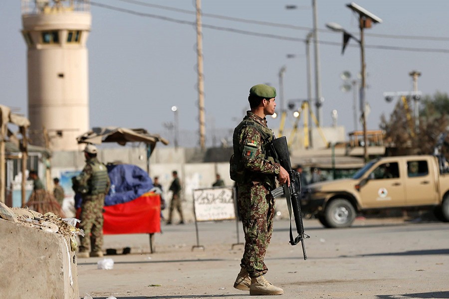 An Afghan National Army (ANA) soldier keeps watch outside the Bagram Airfield entrance gate, Kabul, Afghanistan on November 12, 2016 — Reuters photo