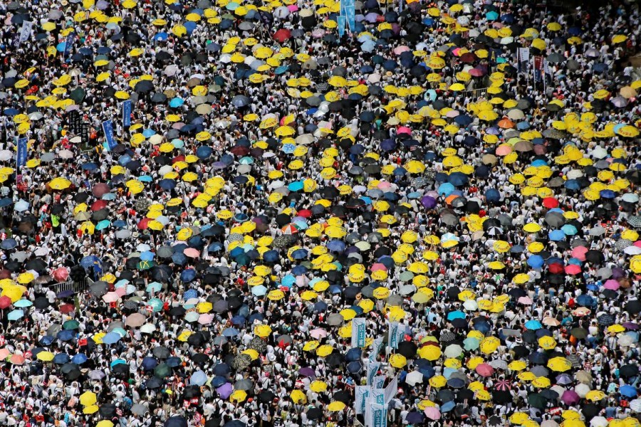 Demonstrators hold yellow umbrellas, the symbol of the Occupy Central movement, during a protest to demand authorities scrap a proposed extradition bill with China, in Hong Kong, China June 9, 2019 - REUTERS/Thomas Peter