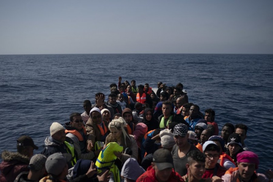 Refugees and migrants wait to be rescued by members of the Spanish NGO Proactiva Open Arms, after leaving Libya trying to reach European soil aboard an overcrowded rubber boat, north of Libyan coast, May 6, 2018. Photo: AP