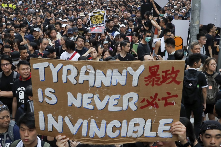 Tens of thousands of protesters carry posters and banners march through the streets as they continue to protest an extradition bill, Sunday, June 16, 2019, in Hong Kong. Hong Kong residents were gathering Sunday for another mass protest over an unpopular extradition bill that has highlighted the territory's apprehension about relations with mainland China - AP Photo/Kin Cheung