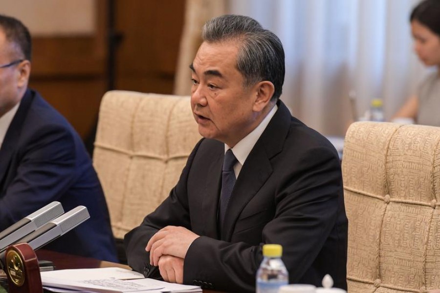 Chinese Foreign Minister Wang Yi listens to Syrian Foreign Minister Walid Muallem (unseen) during a meeting at Diaoyutai State Guesthouse in Beijing on June 18, 2019. Fred Dufour/Pool via Reuters