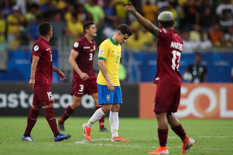 Brazil midfielder Philippe Coutinho (centre) cuts a dejected figure after his goal was ruled out by VAR — AP photo