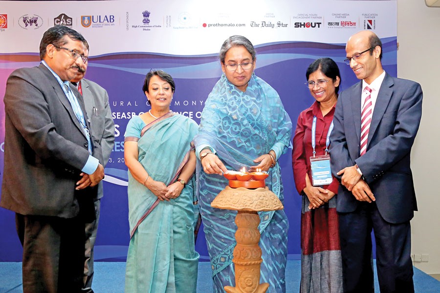 Education Minister Dr Dipu Moni MP inaugurating the eighth SSEASR conference Rivers and Religion by lighting a traditional lamp