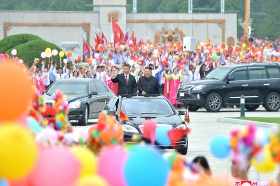 North Korean leader Kim Jong Un welcomes Chinese President Xi Jinping at the Pyongyang International Airport in Pyongyang, North Korea, in this undated photo released on Jun 21, 2019 by North Korea's Korean Central News Agency (KCNA). Reuters