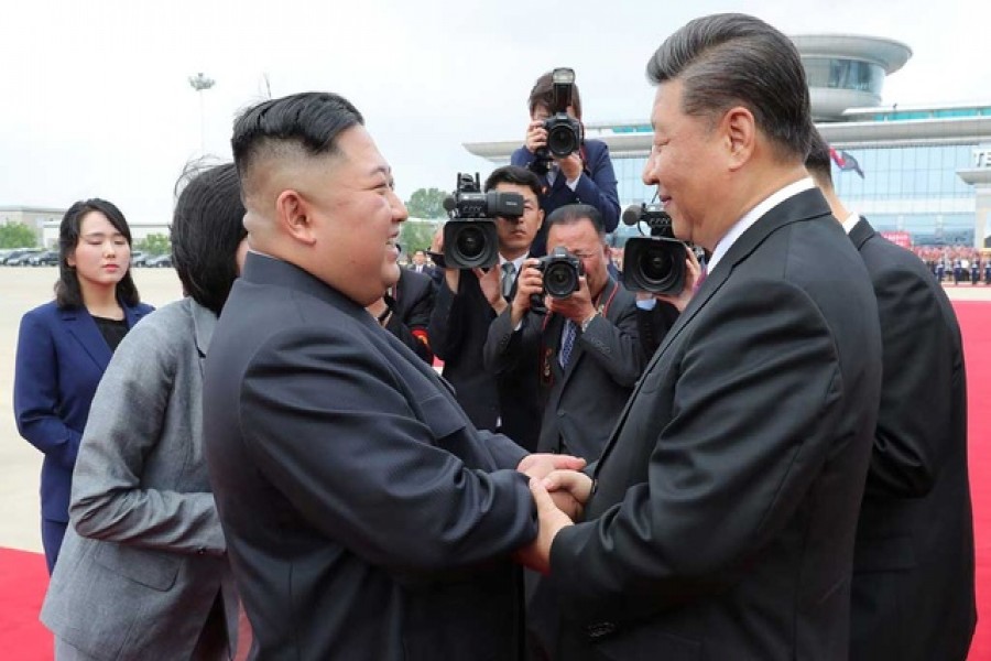 Kim, Xi agree to grow ties whatever external situation