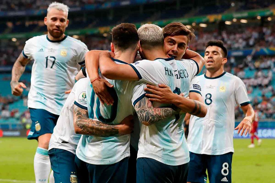 Argentina's Sergio Aguero celebrates scoring their second goal with teammates — Reuters photo