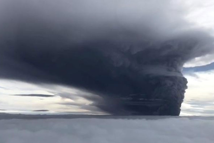 FILE PHOTO - Ash billows from Mount Ulawun during a volcanic eruption, West New Britain, Papua New Guinea June 26, 2019 in this still image taken from social media video - Eroli Tamara via REUTERS