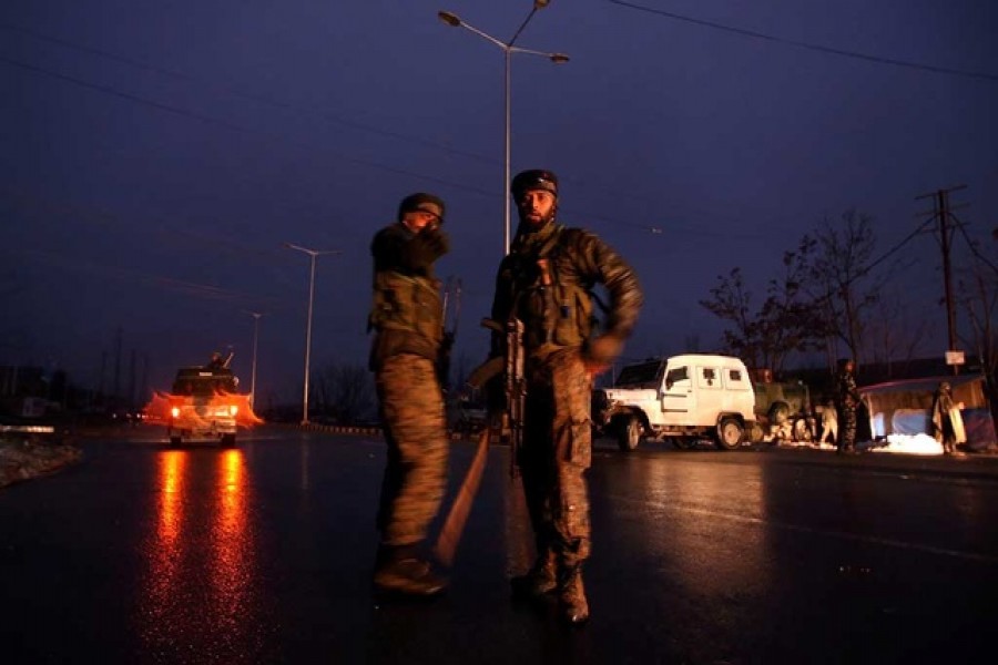 Indian soldiers stand guard near the site of explosion in Lethpora in south Kashmir's Pulwama district Feb 14, 2019. Reuters/Files