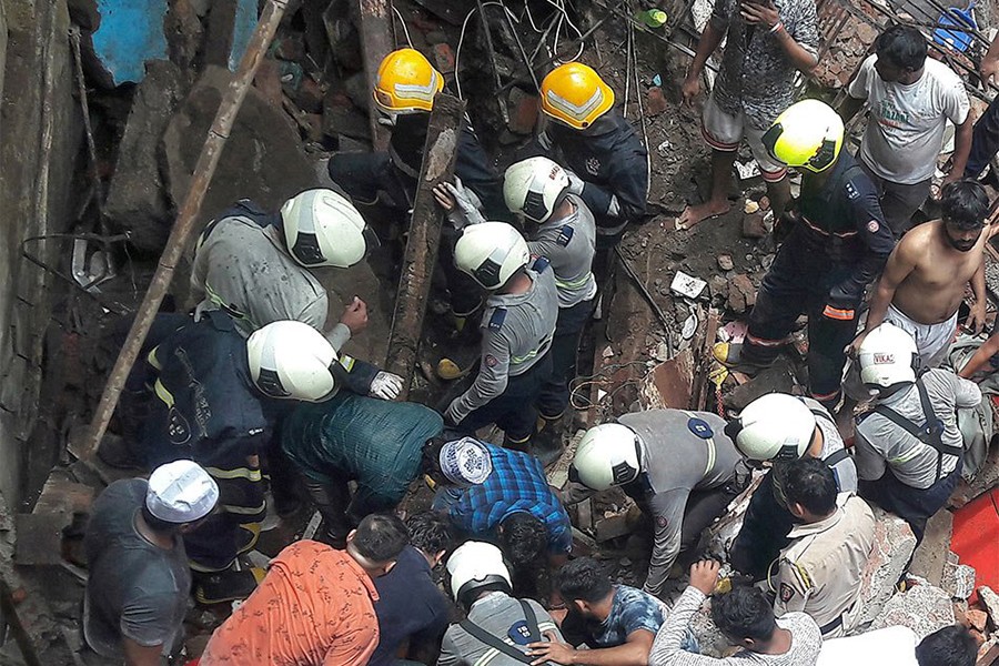 Rescue workers and residents search for survivors at the site of a collapsed building in Mumbai, India on July 16, 2019 — Reuters photo