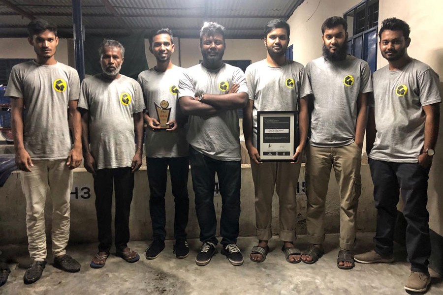 Fahim Uddin Shuvo (centre) with his maverick team of garbagemen