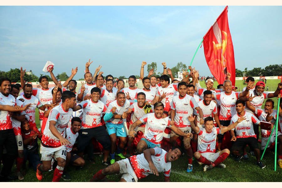 Bashundhara Kings team celebrating with the trophy after winning the BPL title at Sheikh Kamal Stadium in Nilphamari on Thursday	— bdnews24.com