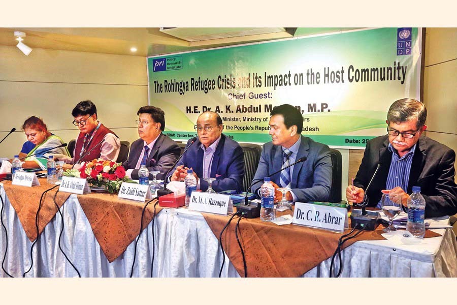 Policy Research Institute of Bangladesh (PRI) Chairman Dr Zaidi Sattar (3rd from right) speaking at a dissemination seminar on ‘The Rohingya Crisis and Its Impact on the Host Community’ at the BRAC Centre Inn in the city on Thursday with Foreign Minister Dr AK Abdul Momen (3rd from left) attending the occasion as the chief guest   — FE photo