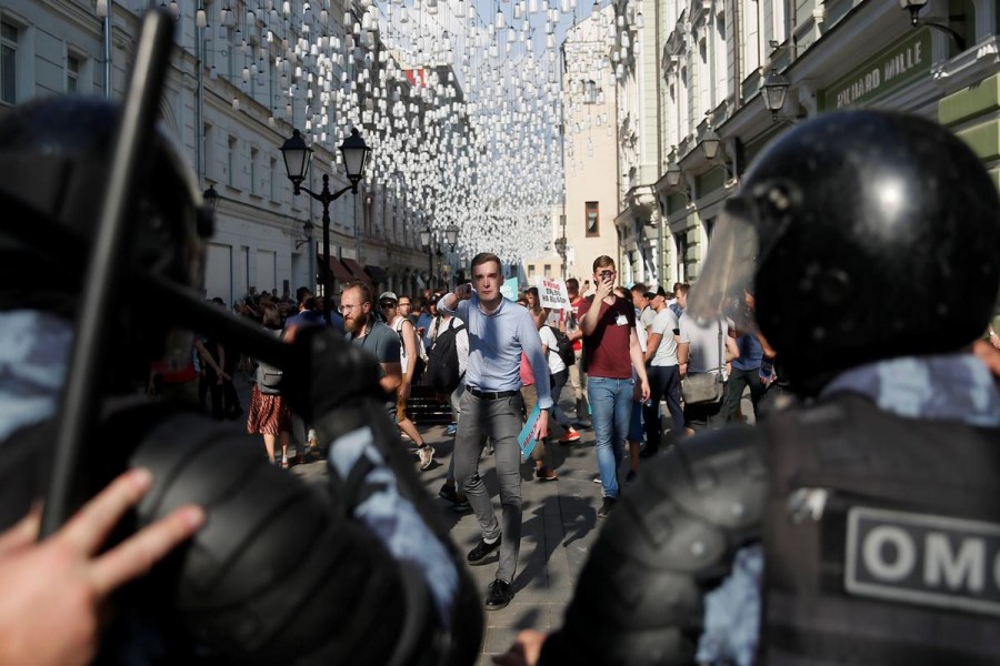 Protesters take part at a rally calling for opposition candidates to be registered for elections to Moscow City Duma, the capital's regional parliament, in Moscow, Russia July 27, 2019. REUTERS/Maxim Shemetov