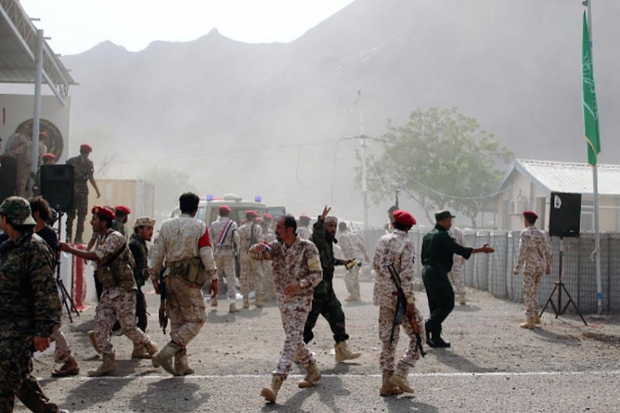 Soldiers rush to help the injured following a missile attack on a military parade during a graduation ceremony for newly recruited troopers in Aden, Yemen on August 1, 2019 — Reuters photo