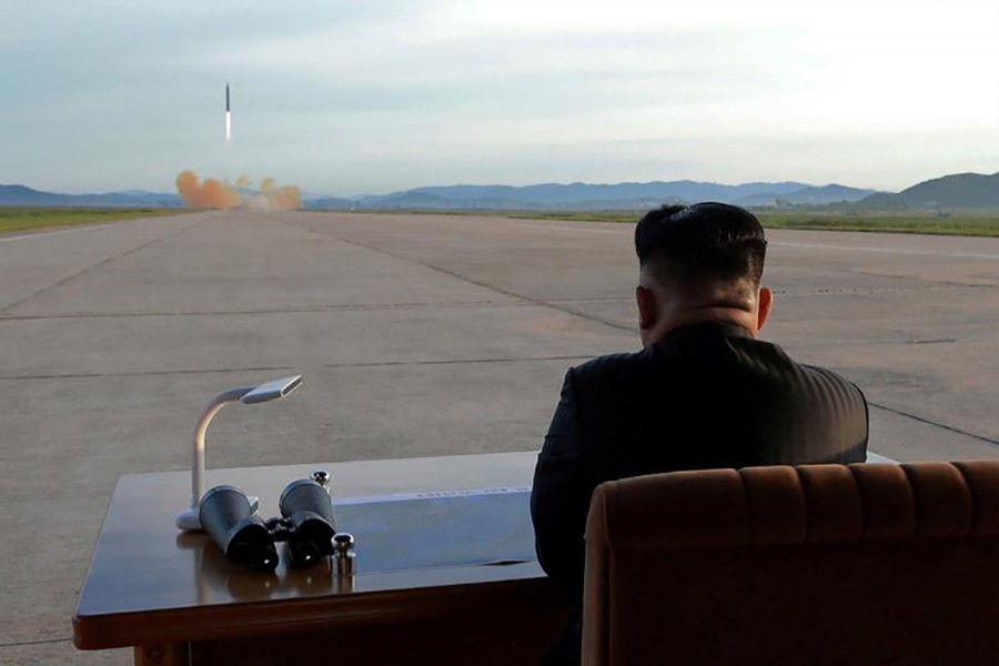 North Korean leader Kim Jong Un watches the launch of a missile in this undated Reuters photo