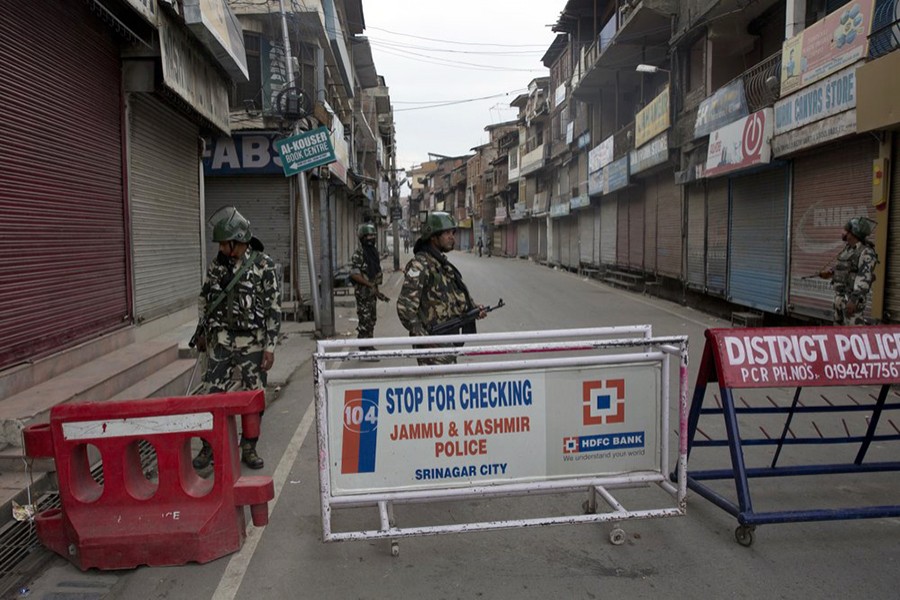 Indian Paramilitary soldiers stand guard during curfew in Srinagar, Indian controlled Kashmir, Wednesday, on August 7, 2019 — AP photo