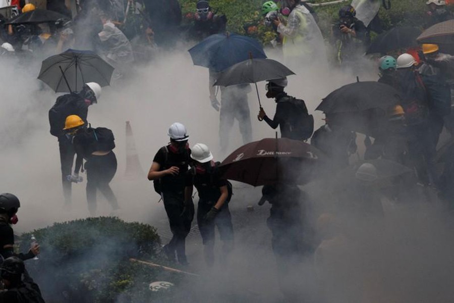 Anti-extradition bill protesters are surrounded by tear gas during clashes with police in Tsuen Wan in Hong Kong, China on August 25, 2019 — Reuters photo