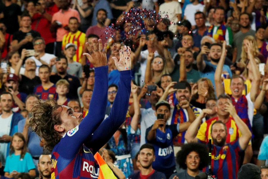 Barcelona's Antoine Griezmann comes up with glitter celebration after scoring their second goal against Real Betis — Reuters photo