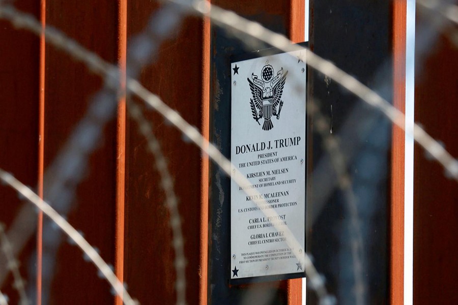 A plaque commemorating US President Donald Trump hangs on the US-Mexico border fence as Trump visits the US-Mexico border in Calexico, California, US on April 5, 2019 — Reuters/Files