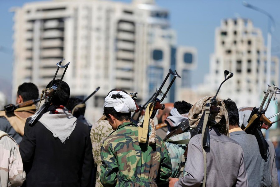 Armed Houthi followers carry their rifles as they attend a gathering to show support for the Houthi movement in Sanaa, Yemen December 19, 2018. Reuters/Files