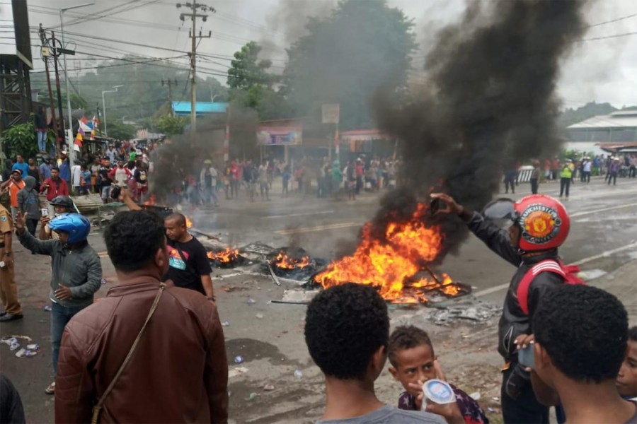 People burn tires during a protest at a road in Manokwari, West Papua, Indonesia, August 19, 2019 in this photo taken by Antara Foto. Antara Foto/Toyiban/via REUTERS