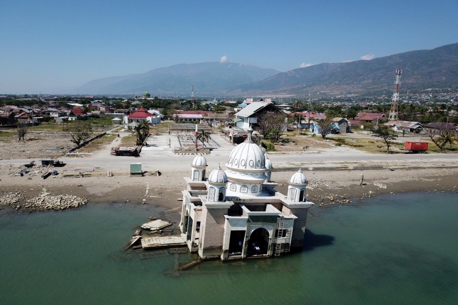 An aerial view of a devastated region nearly one year after an earthquake and tsunami, taken over Sulawesi, Indonesia, sometime in September 2019 by a drone and obtained from social media. UN OCHA Asia-Pacific via REUTERS