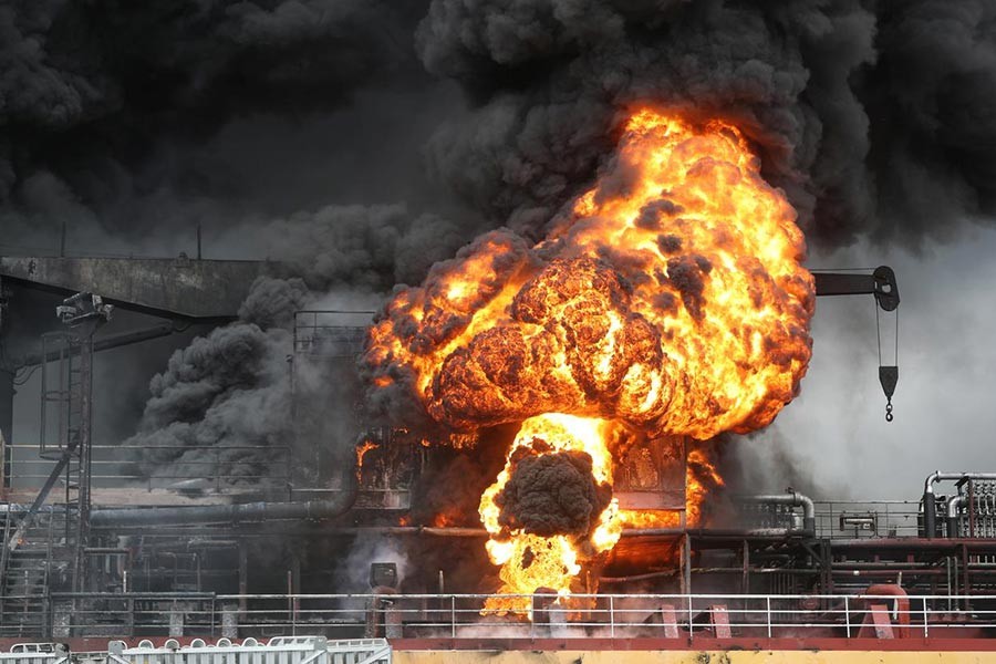 Fire from a vessel is seen at a port in Ulsan, South Korea, on Saturday. -Reuters Photo