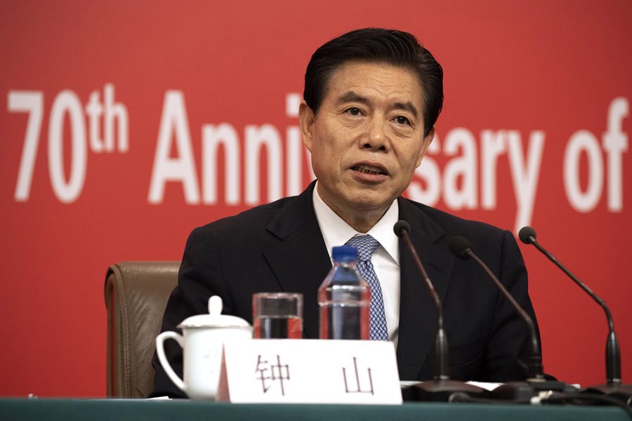 Chinese Commerce Minister Zhong Shan speaking during a press conference on the sidelines of the upcoming 70th anniversary of the Founding of the People's Republic of China in Beijing on Sunday. -AP Photo