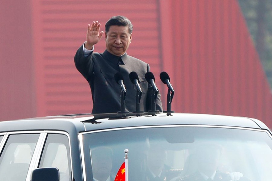 Chinese President Xi Jinping waves from a vehicle as he reviews the troops at a military parade marking the 70th founding anniversary of People's Republic of China on October 1, 2019 — Reuters photo