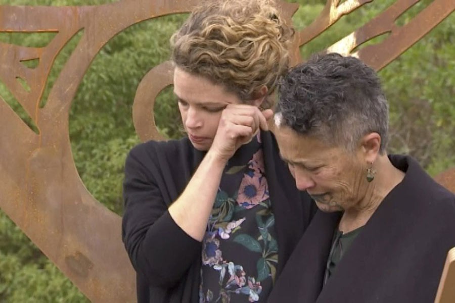 British High Commissioner Laura Clarke, left, wiping her tears after hugging a Maori elder, right, when she visited the town of Gisborne, New Zealand, Wednesday. -AP Photo