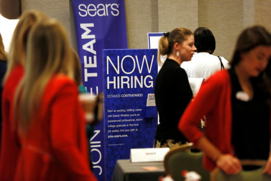 Recruiters and job seekers are seen at a job fair in Golden, Colorado, June 7, 2017. Reuters/Files