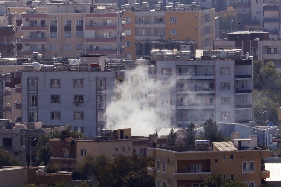 In this photo taken from the Turkish side of the border between Turkey and Syria, in Ceylanpinar, Sanliurfa province, southeastern Turkey, smoke billows from targets in Ras al-Ayn, Syria, caused by shelling by Turkish forces on Friday, October 18, 2019 — AP photo