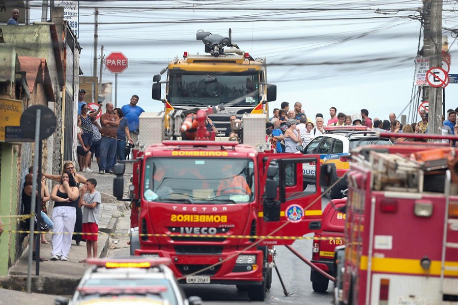 Firefighters work near the site where a small plane crashed on a residential street in Belo Horizonte, Brazil on October 21, 2019 — Reuters photo