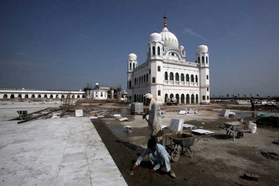 Labourers work at the sites of the Gurdwara Darbar Sahib, which will be open this year for Indian Sikh pilgrims, in Kartarpur, Pakistan Sep 16, 2019. REUTERS